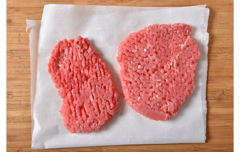 Monthly beef subscription featuring fresh ground beef on parchment paper, ready for cooking recipes