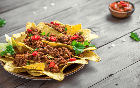 Delicious nachos topped with grass-fed ground beef from Old Time Farm, perfect for sharing at gatherings