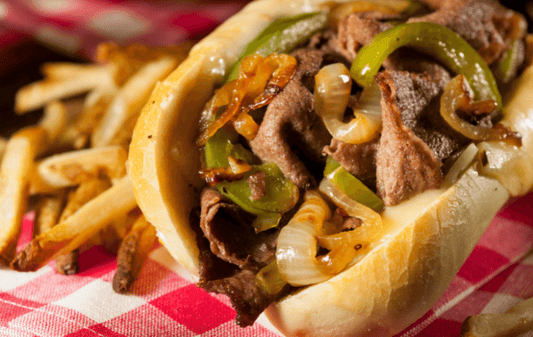 Make a delicious beef sandwich with grilled peppers and onions served with fries with an Old Time farm monthly beef share subscription in Pittsburgh